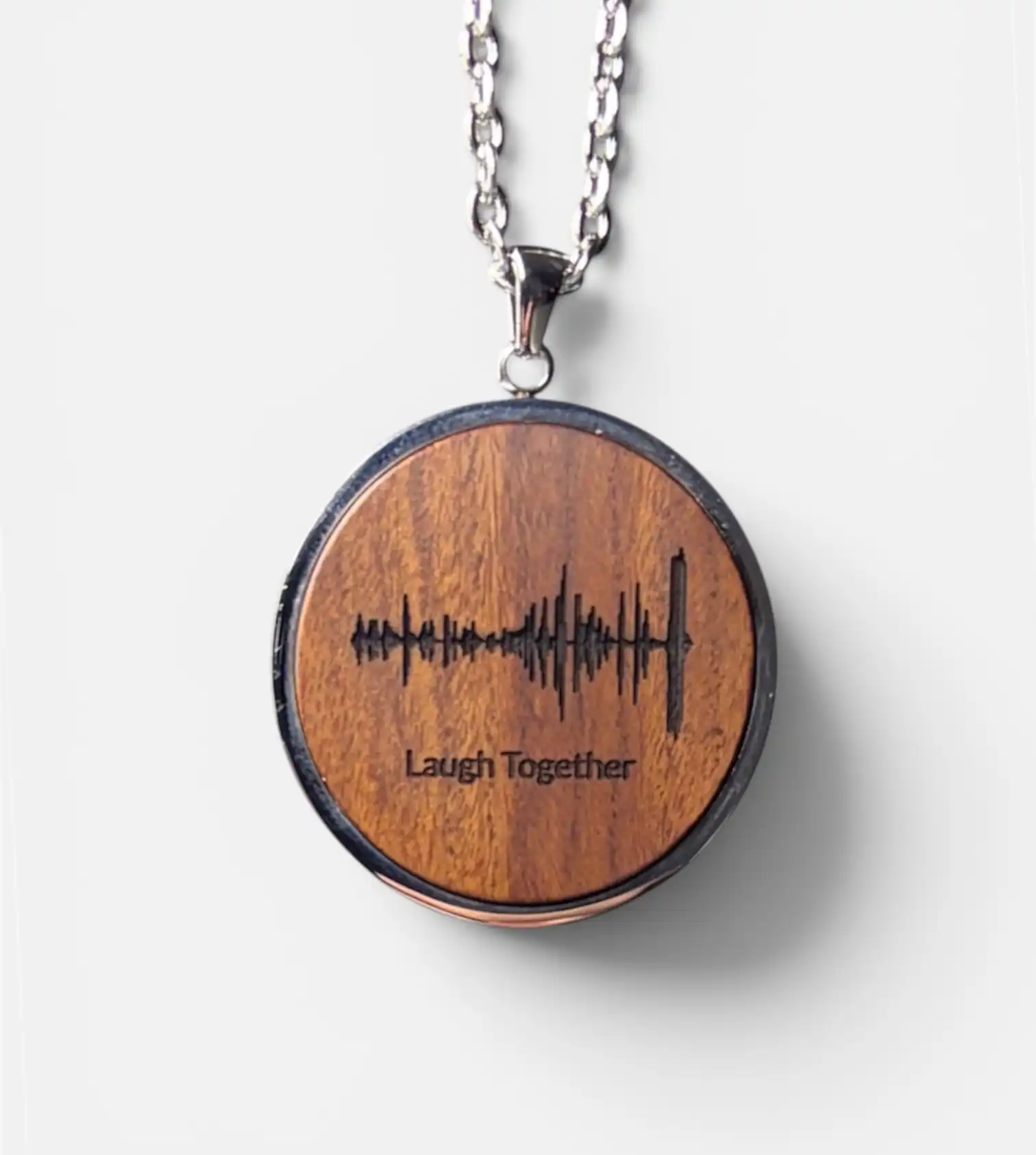 Circle voice recording necklace engraved with a Soundwave